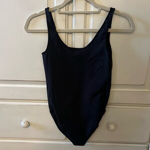 SKIMS body suit size S/M with snap closure on bottom